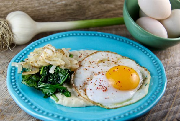 Savory Breakfast Polenta with Eggs, Sautéed Onions, and Spinach