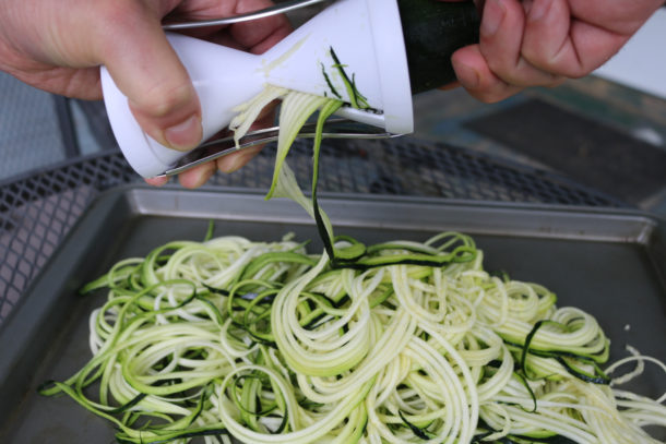 Low carb zucchini noodles being spriralized
